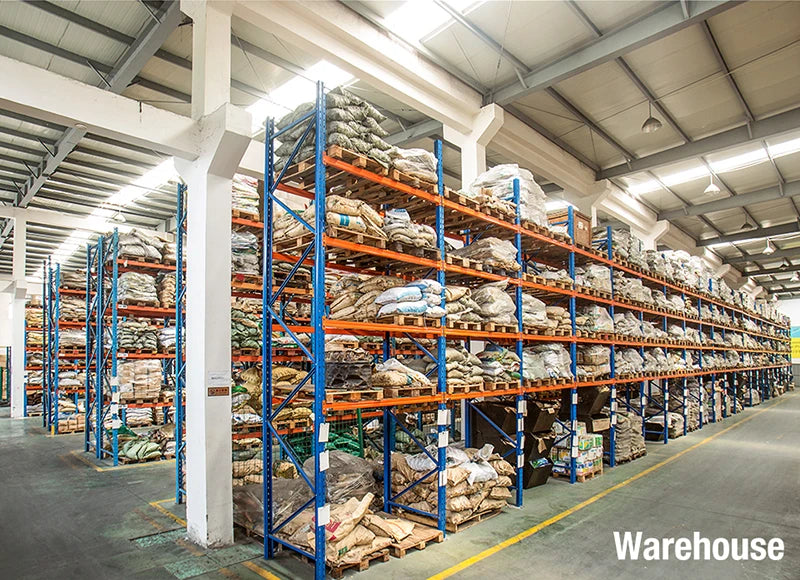 Warehouse interior showing large racks of natural blue cat eye stone beads for jewelry making