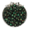 A silver dish filled with round, dark green and reddish-brown glitter resin beads for jewelry making.