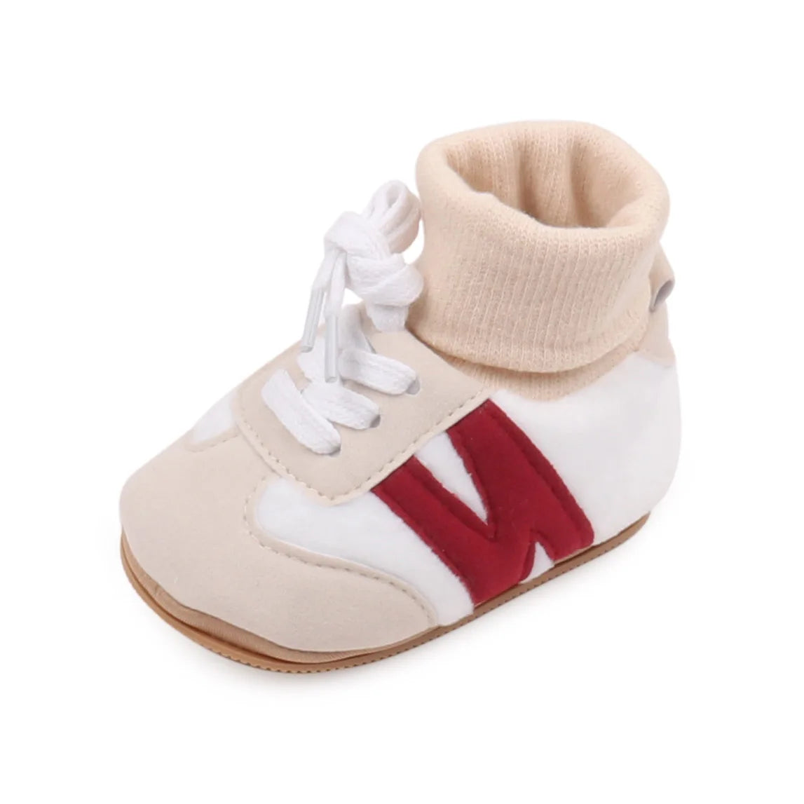 A pair of beige and white ankle-hugging baby booties with a red letter M detail and anti-slip soles.