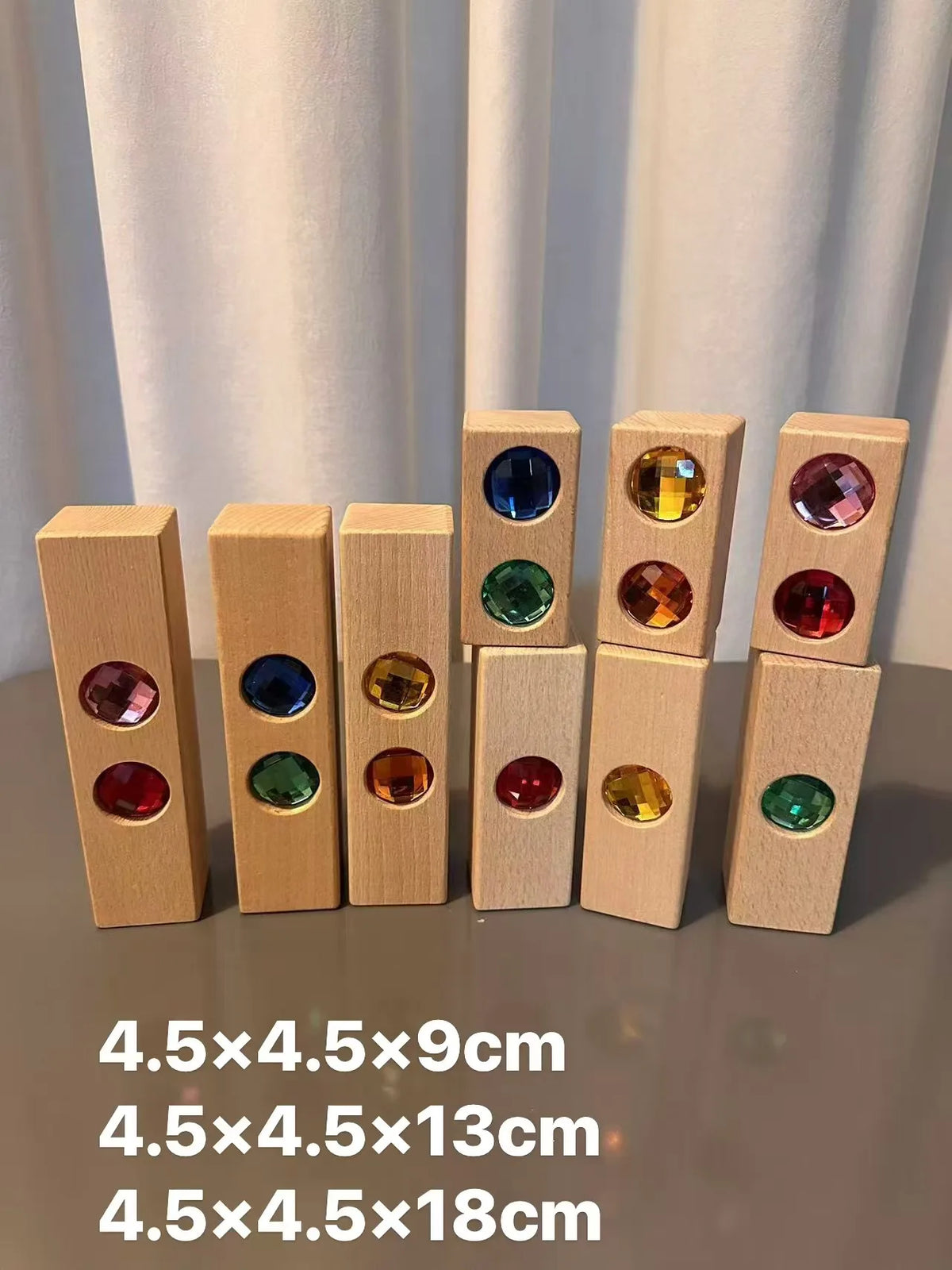 A set of wooden gemstone building blocks featuring acrylic crystals in various colors and sizes.