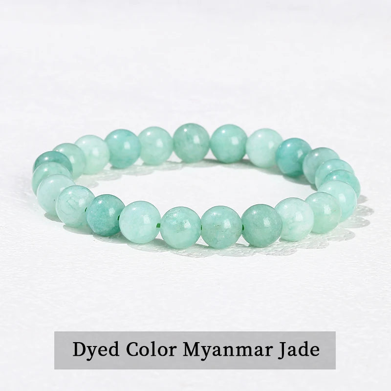 A bracelet made of dyed color Myanmar jade beads on a white background.