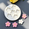 White silicone mold with daisy flower shapes for fondant and cake decorating
