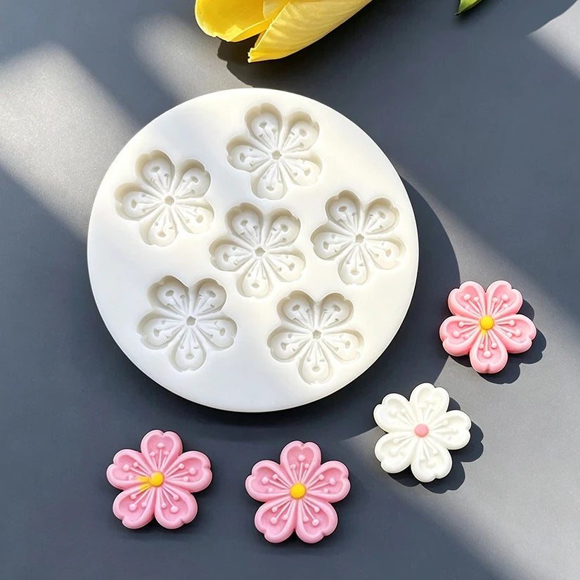 White silicone mold with daisy flower shapes for fondant and cake decorating