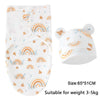 White cotton newborn swaddle blanket and hat set with rainbow and leaf patterns