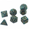 A set of six dragon-inspired polyhedral dice in teal and gold colors.