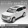 A white 1:32 scale diecast model of a Cadillac Escalade SUV.