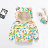 A light yellow and green cartoon-themed puffer jacket for a child with a hood and zipper.