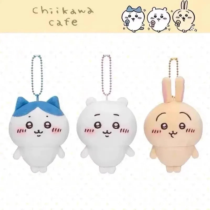 Three white and pink Chiikawa plush characters with dangling charms displayed against a light background.