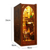 A wooden miniature bookshelf book nook kit featuring an arched display with internal lighting.