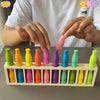 A person is assembling a 20-color matching bottle puzzle game set with various colored bottles.