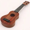 A wooden ukulele toy with a brown body and neck, showing the fretboard and tuning pegs.