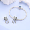Sterling silver heart charm beads for bracelets featuring a blue gemstone and dangling charms