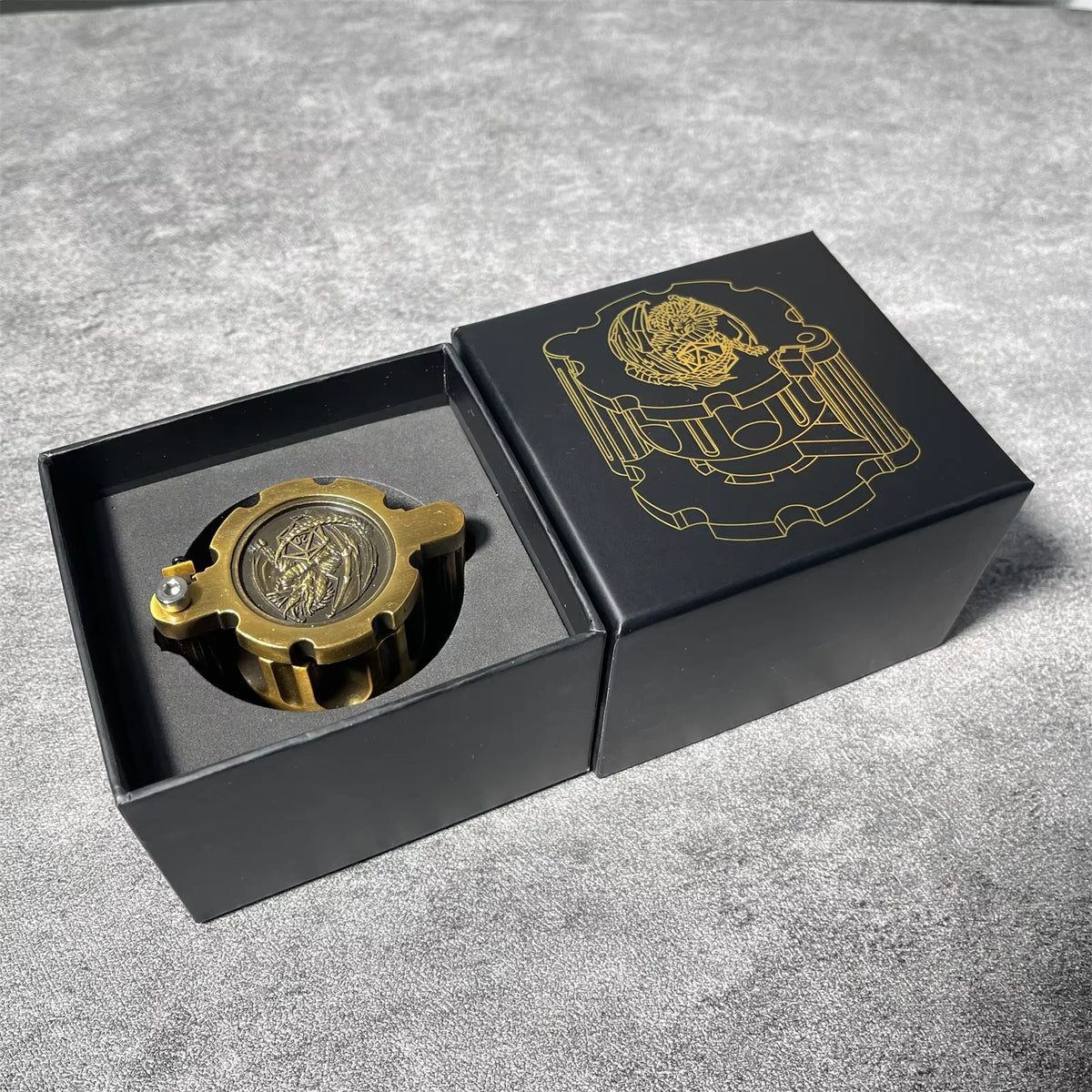 A black box containing a brass revolver-shaped metal dice set for RPG games.
