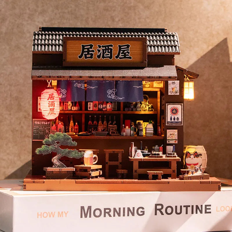 A detailed wooden miniature dollhouse kit of a Japanese restaurant featuring a facade and interior display.