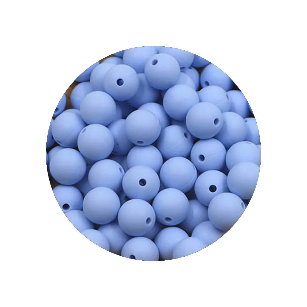 A circular arrangement of small, light blue silicone beads for DIY jewelry making.