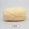A ball of light yellow pre-dyed milk cotton yarn used for knitting and crochet.