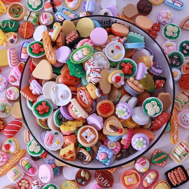 A colorful assortment of miniature dollhouse snack foods including candies, cookies, and savory items.