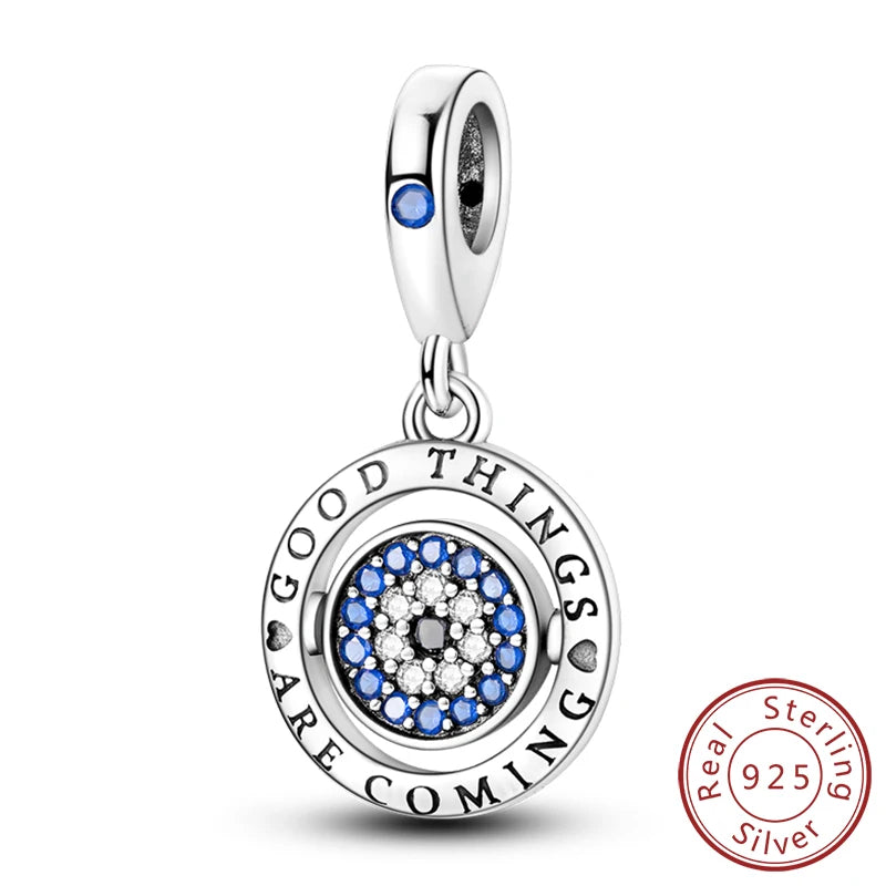 Sterling silver charm beads set featuring cross, angel, and evil eye designs for DIY jewelry making