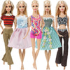 Five dolls wearing various casual outfits including tops, skirts, and pants in bright colors