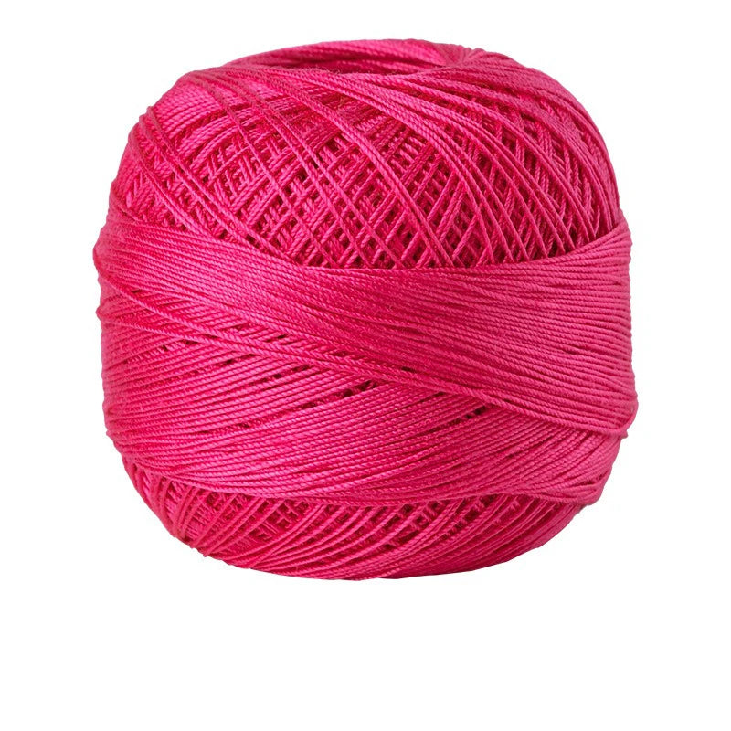 A ball of bright pink crochet thread used for tatting and embroidery.
