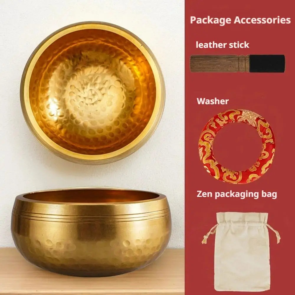 A golden singing bowl and a matching packaging bag with leather stick and washer accessories.