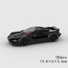 A black classic rally car building block set with a transparent red cockpit and wheels.