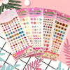A collection of colorful acrylic rhinestone stickers in various shapes and colors for crafts and DIY projects.