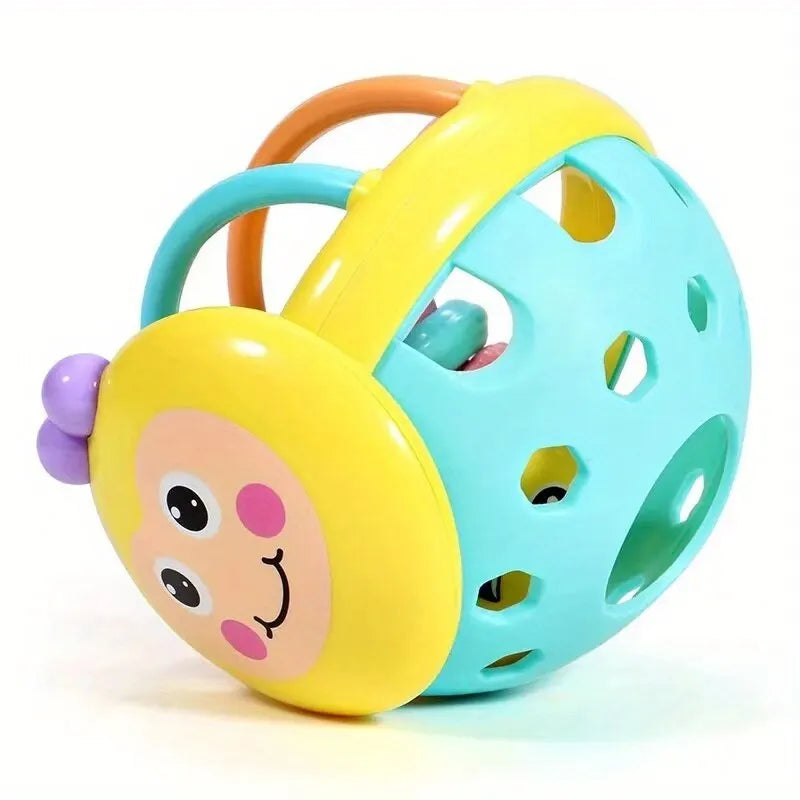A yellow and blue sensory catch ball rattle toy for babies with orange handles.