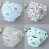 A set of reusable cotton potty training pants for toddlers featuring various animal and food patterns.