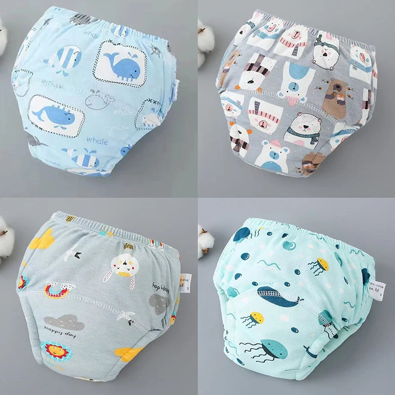 A set of reusable cotton potty training pants for toddlers featuring various animal and food patterns.
