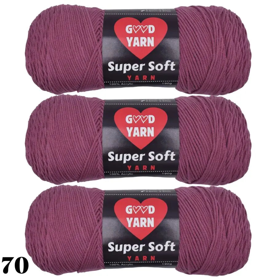 Three skeins of Super Soft Yarn in a dusty rose color for crochet and knitting projects