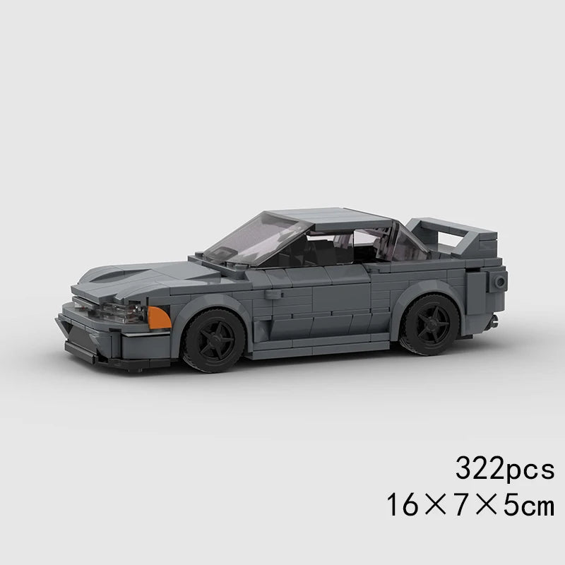 A gray LEGO building block model of a classic rally car with a glass roof.