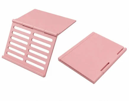 A pink foldable Mahjong card holder with a non-slip stand shown in two views.