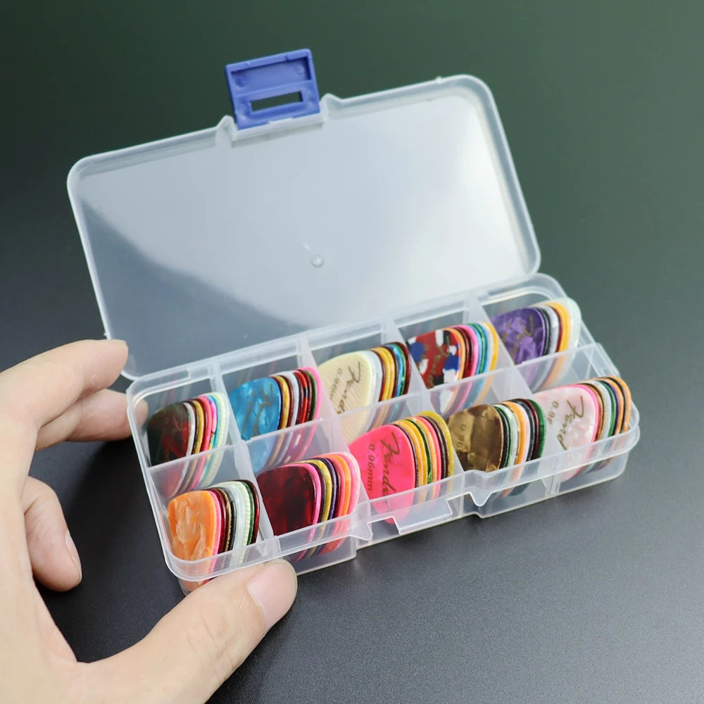 A clear plastic storage box filled with various colored guitar picks and a lid.