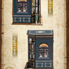 A DIY bookstore book nook kit featuring a miniature wooden display cabinet with an arched window and internal shelving, shown