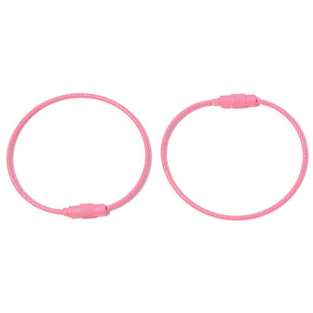 A pair of pink stainless steel wire keychain rings with screw locks.