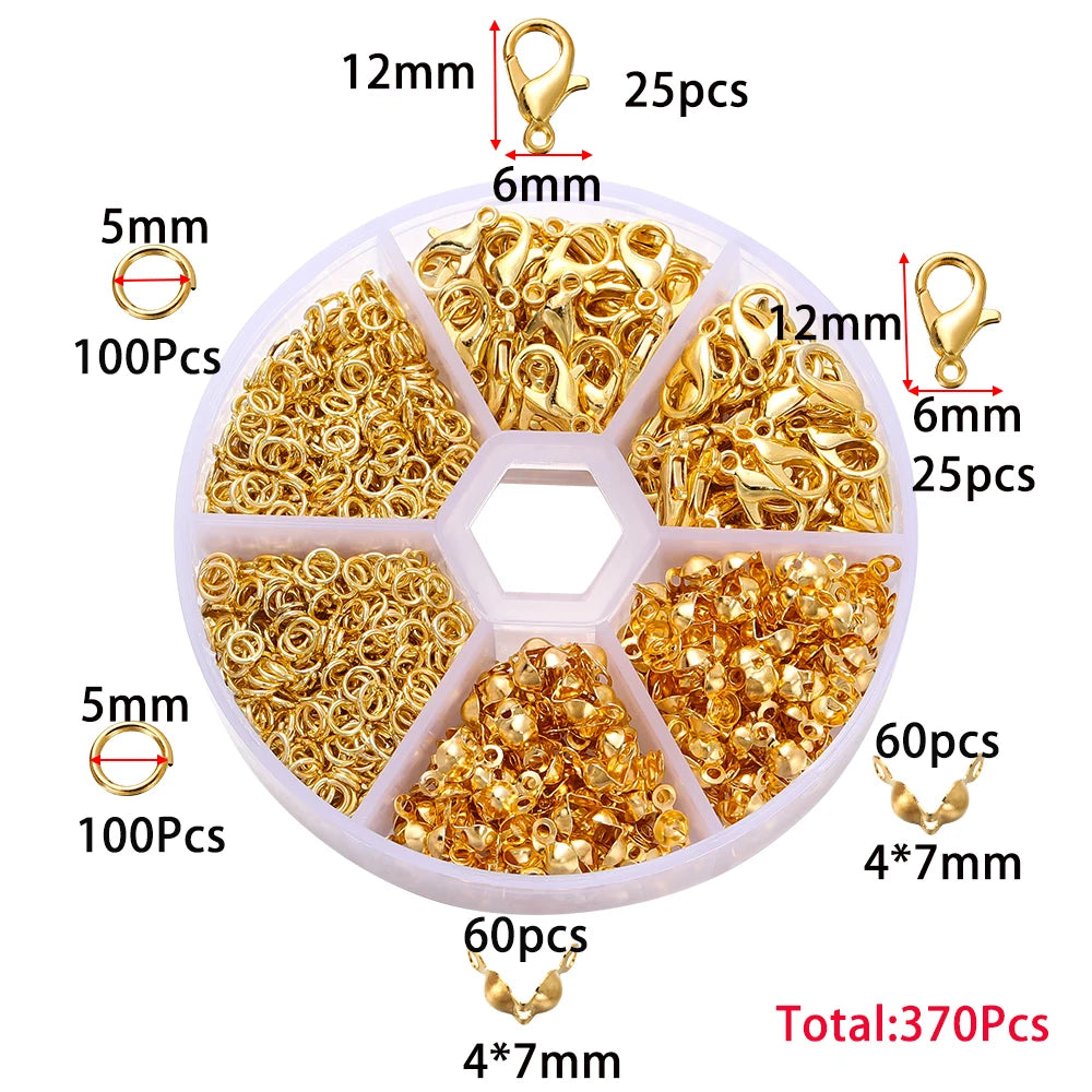 Jewelry making kit containing various gold-colored jump rings and clasps packaged in compartments.