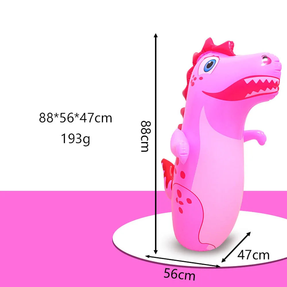 Pink inflatable dinosaur punching bag with measurements and scale reference.