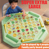 A green board game featuring animal flip chess and memory matching tiles, with a child playing on it.