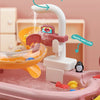 A pink kids kitchen sink toy with an electric water outlet and rotating water feature for a fishing game.
