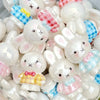 A collection of white and pink Miffy 3D resin bead phone charm keychains in various shapes and expressions.