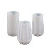 Two white flexible silicone molds shaped like flower pots for DIY concrete projects