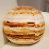 A round plush toy depicting the solar system with striped orange and white bands.