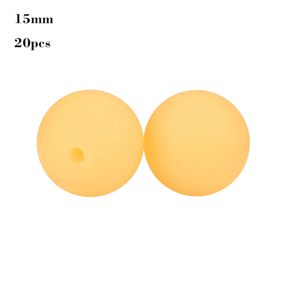 Two round, translucent yellow silicone beads for jewelry making