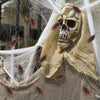 A skull mask is adorned with several realistic fake cockroaches on a piece of fabric.