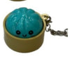 A light blue dumpling-shaped squishy keychain with a gold-colored loop and chain.