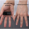 A hand holds a black floating can magic trick demonstrating levitation effect from both perspectives.