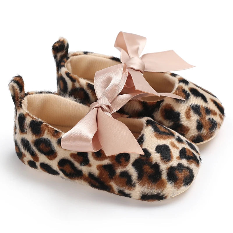 Pair of leopard print soft sole baby sneakers with pink satin bows