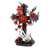 A black skeleton hand cross with red roses and white bones, part of a building kit.