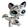 A white and black cat bobble head figurine with large blue eyes and pink accents.